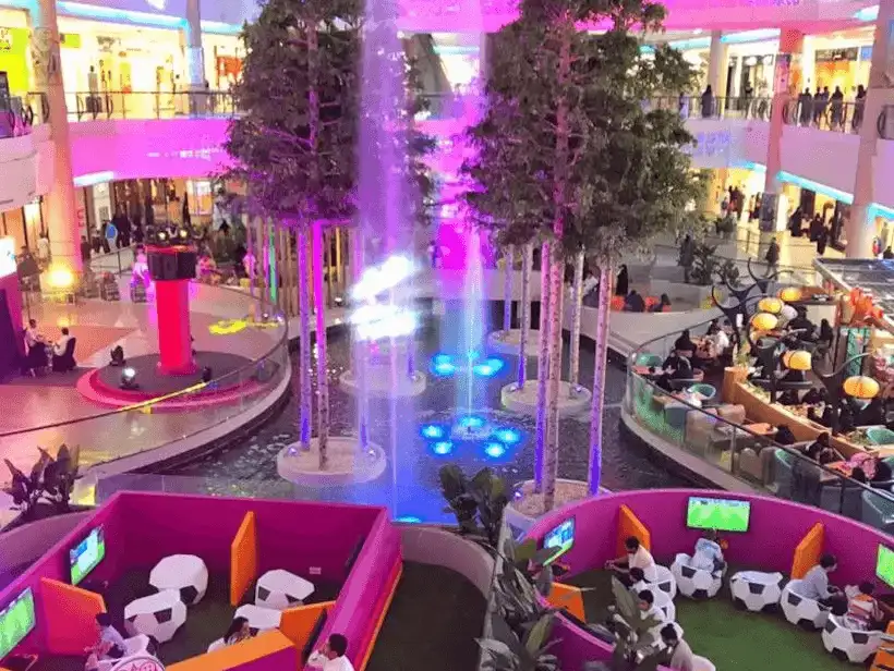 Fountain area with trees inside Riyadh Gallery Mall.