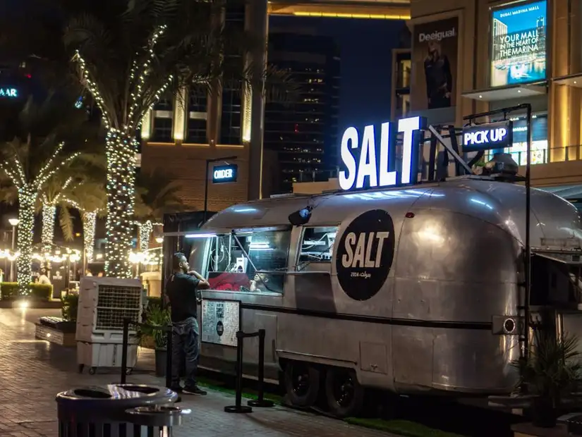 Night view of the Salt food truck in a vibrant outdoor setting.