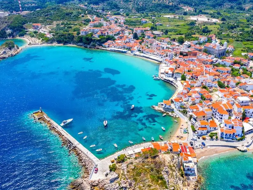 Aerial view of Vathy’s turquoise waters and charming architecture.