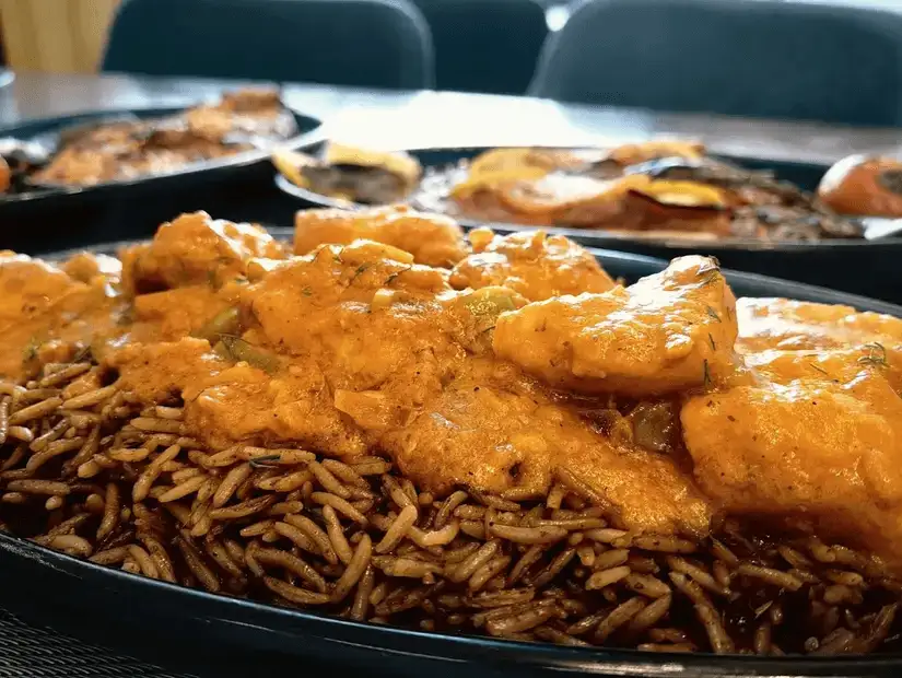 Spicy fish curry served over flavorful rice.