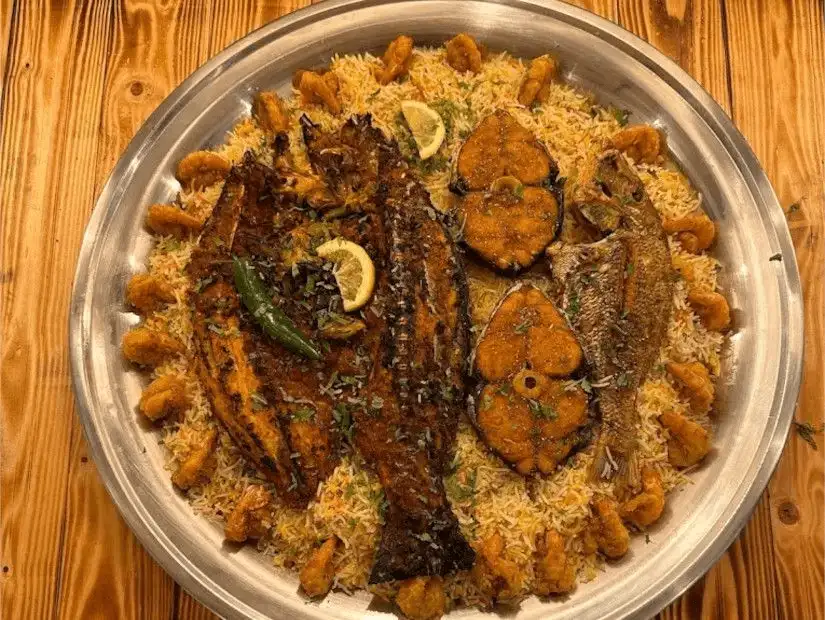 A platter of spiced grilled fish served on fragrant rice.