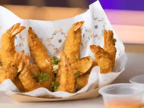 Golden fried shrimp basket, a perfect snack for seafood lovers.