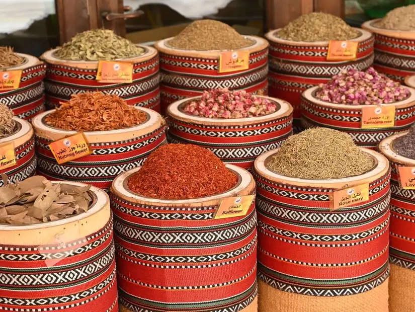 Aromatic spices and herbs in woven baskets at a local spice souk.