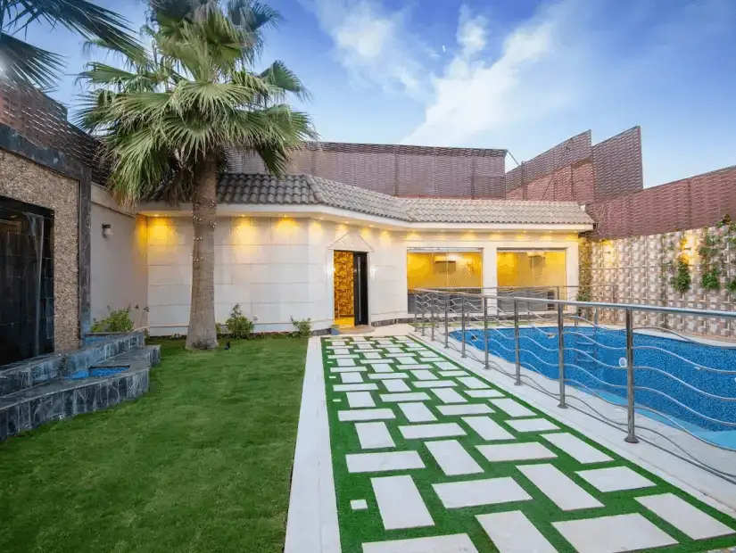 A stylish and spacious chalet featuring a well-maintained pool, perfect for relaxation, with a modern outdoor setting.