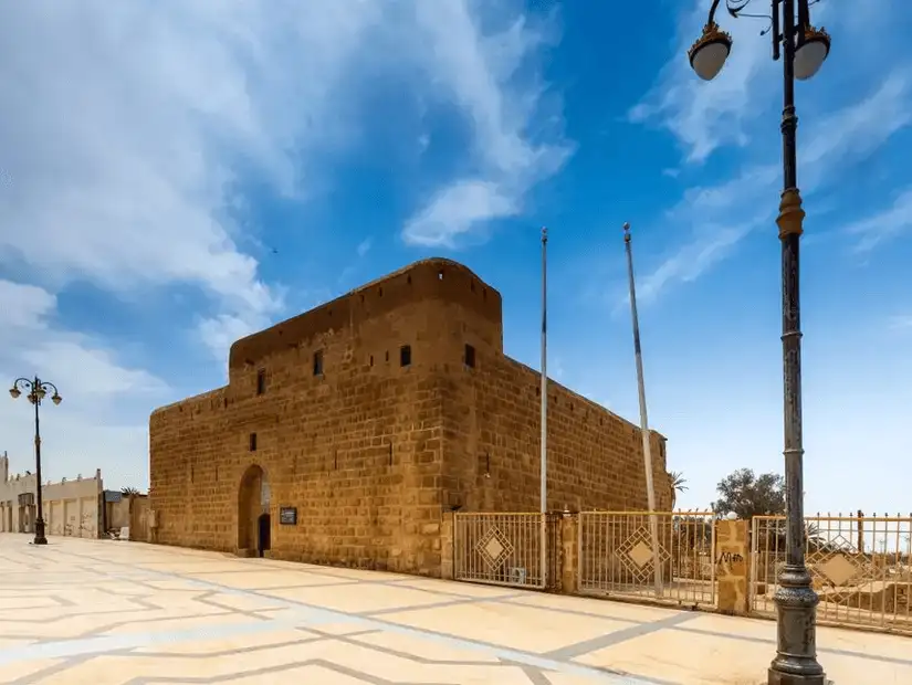 Majestic Tabuk Castle under a clear blue sky.