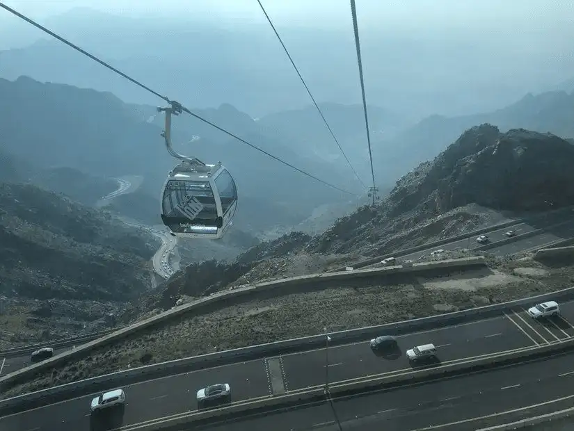 A scenic cable car ride offering breathtaking views of the mountains.