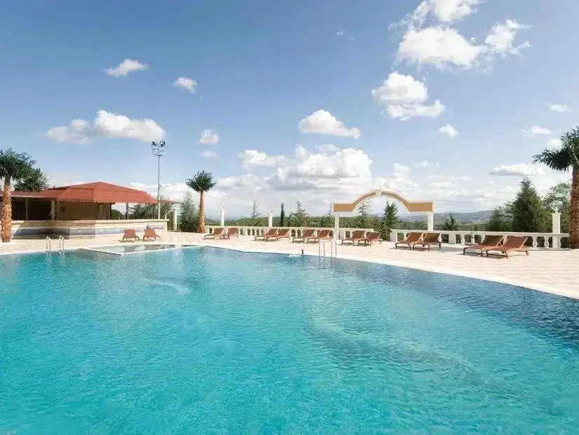 A serene spa with a luxurious pool offering wellness and relaxation.