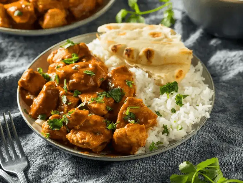 Aromatic Indian curries served with fresh flatbread, perfect for a hearty meal.