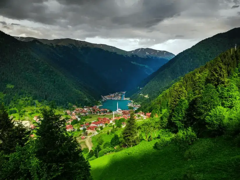 The picturesque Uzungöl Lake nestled between forested mountains in Trabzon.