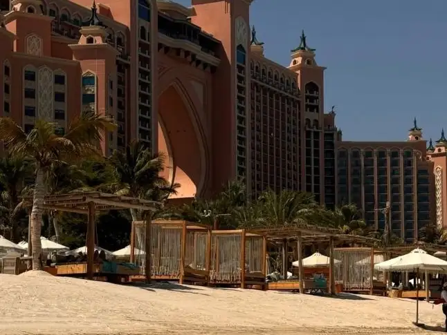 Luxurious Atlantis Hotel towering over the sandy shores of White Beach.