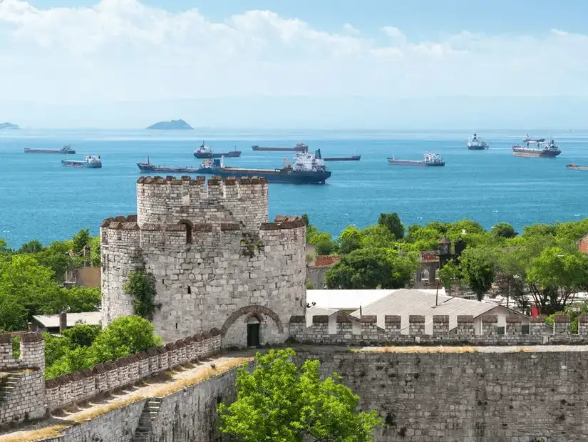 A view of the Yedikule Fortress, with its historic towers and strong defensive walls overlooking the surrounding area.