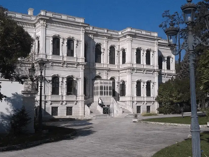 The exterior of Yildiz Palace, a grand historical building with ornate architecture, surrounded by lush gardens and a serene atmosphere.