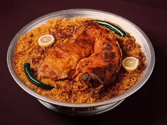 A feast of Middle Eastern rice and meat dishes, artfully presented in traditional style.