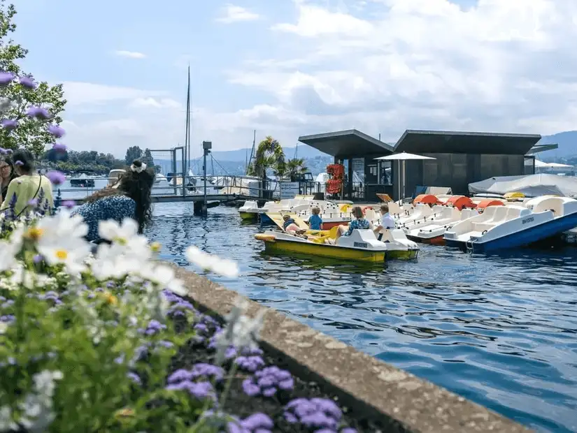 Boats docked by the beautiful lakeside in Zurich.